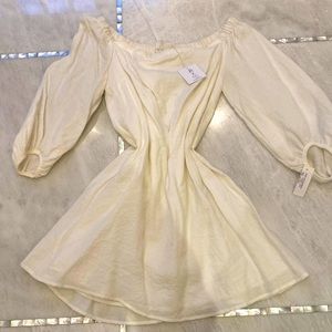 Ladies cream dress with balloon sleeves. Dress it up or down.